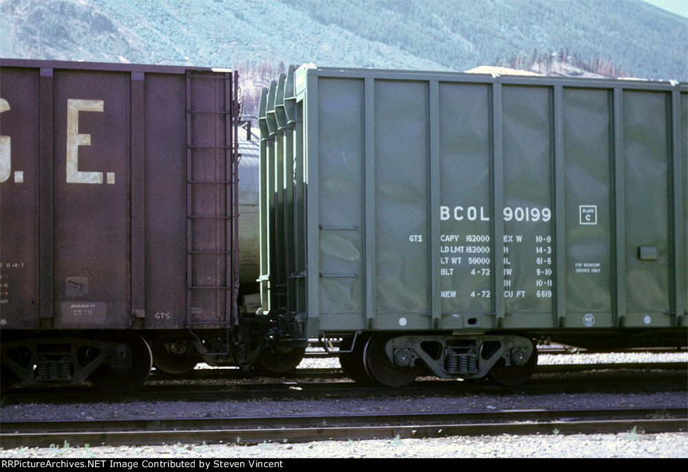 BC Rail woodchip gondola. BCOL #90199 next to older PGE gon.